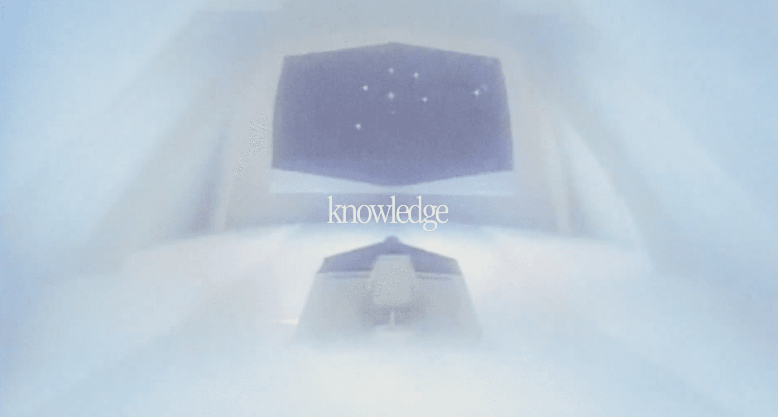 Hazy, bright white image of a futuristic control room with a central console and the word knowledge centered on screen.